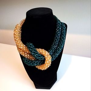 Green and brown/gold handmade glass knot necklace.